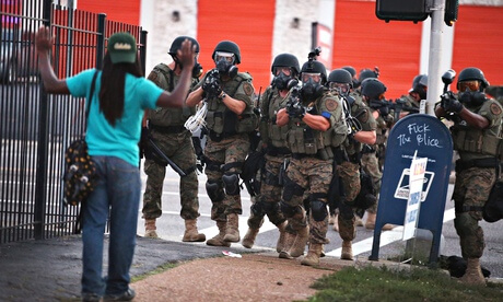 Police confront a protester in St Louis