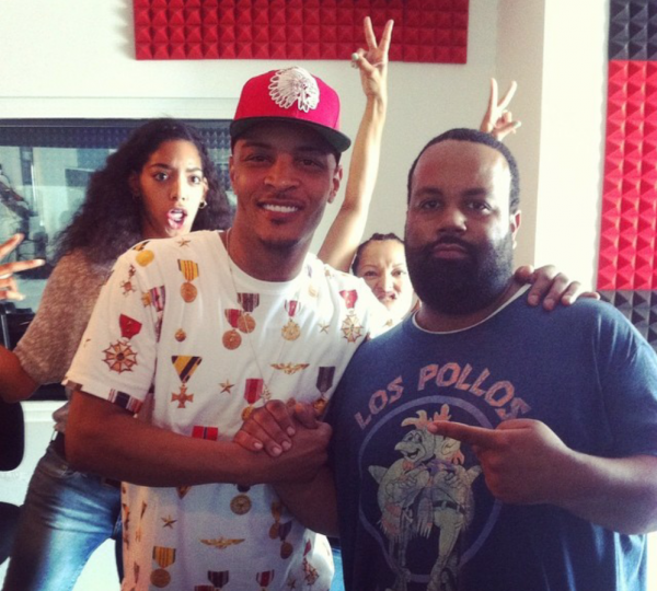 ><figcaption>T.I. and Russ Parr Morning Show Producer Albert. Photobomb courtesy of Britt and Alfredas.</figcaption></figure>
<p>The <a href=