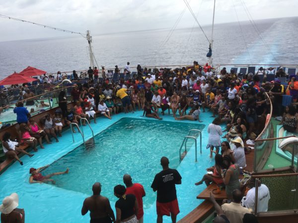 ><figcaption>Attendees relaxing by the pool.</figcaption></figure>
<figure class=