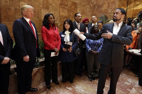 ><figcaption>What is this?… posing backstage at a hip-hop music concert?</figcaption></figure>
<p>If you are still wondering why people continue to lose faith in the black church, here is another reason, Reverend Darrell Scott. <strong>Ohio Reverend Darrell Scott</strong> was obviously looking for an opportunity from the White House for himself when he flat out lied during a roundtable�recorded visit to a White House black history event as he “trivialized a serious situation” by speaking as a self-appointed spokesperson for “gang thugs” who would “lower the body count” if given federal funds. The social nets immediately expressed disbelief in the Ohio-based minister’s claims. Rev Michael Pfleger an <em>ACTUAL</em> Chicago based�reverend busted Scott on his “Obsession�with Chicago with his tweets and doing nothing, This is too serious to be making crazy comments.” The Rev went on to say “This is an insult to Chicago.” Christopher Mallette, the Executive Director of the Chicago Violence Reduction Strategy, an ACTUAL anti-violence crusader IN Chicago, wasn’t invited to the Black History event at the White House otherwise, he would have stated the truth to Trump. See vid below.<iframe loading=