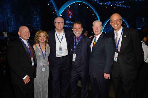 ><figcaption>Pictured (left to right): Steve Schultz, Rep. Debbie Wasserman Schultz, Rep. Joe Crowley, SESAC’s Dennis Lord & Pat Collins and Rep. Ted Deutch.</figcaption></figure>
<p><strong class='StrictlyAutoTagBold'>SESAC</strong> was a proud sponsor of the 2014 MusiCares Person of the Year event honoring Carole King on Friday, January 24 in Los Angeles. The all-star tribute featured stellar performances by the likes of Lady Gaga, James Taylor, Pink, Steven Tyler and Alicia Keys, all in recognition of Ms. King’s extraordinary musical accomplishments as well as her charitable endeavors. <strong class='StrictlyAutoTagBold'>SESAC</strong> executives were in attendance at the prestigious event and hosted several artist affiliates and representatives from Congress.</p><div class='code-block code-block-8' style='margin: 8px auto; text-align: center; display: block; clear: both;'>
  <img src=